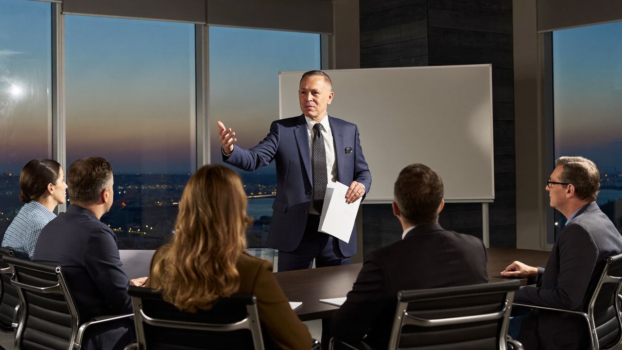 A chief executive presenting a clear three-milestone direction to the board